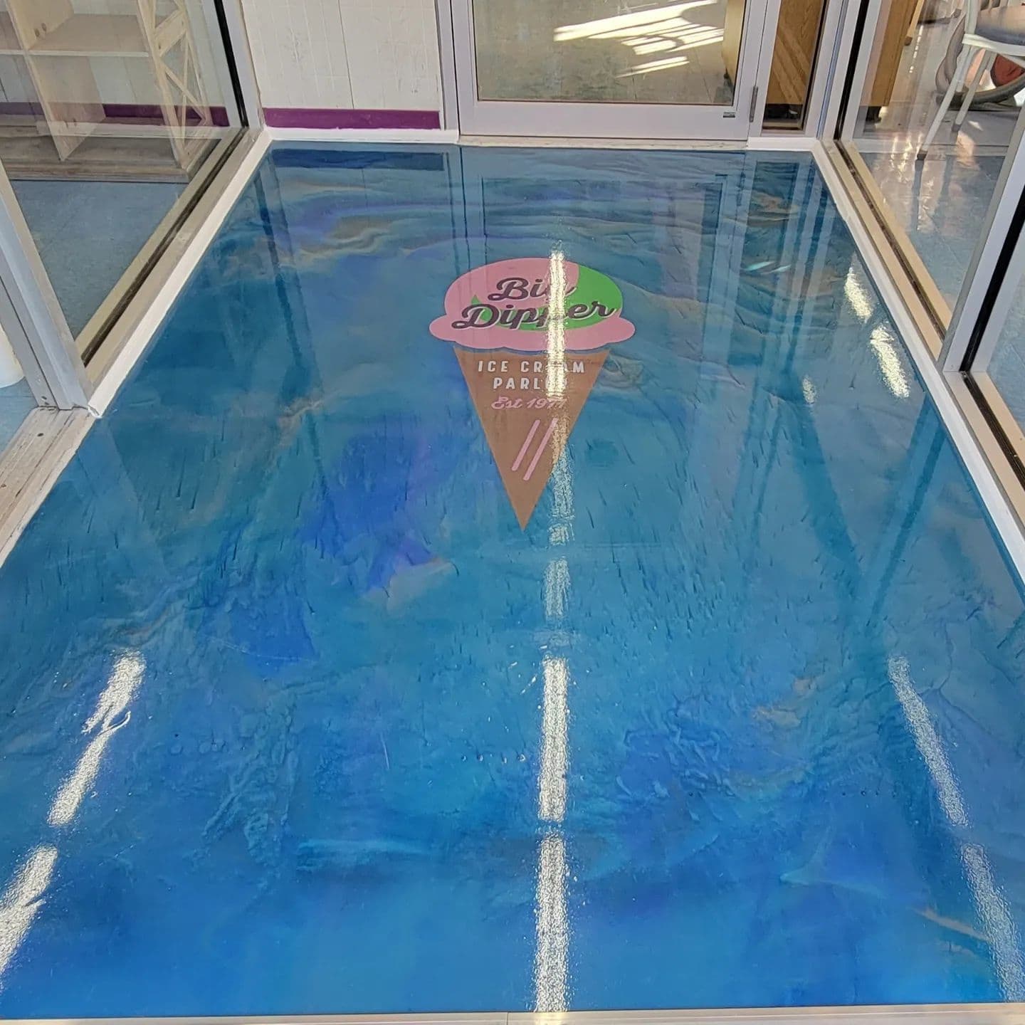 Metallic blue epoxy floor installed by J&K Precision Cleaning