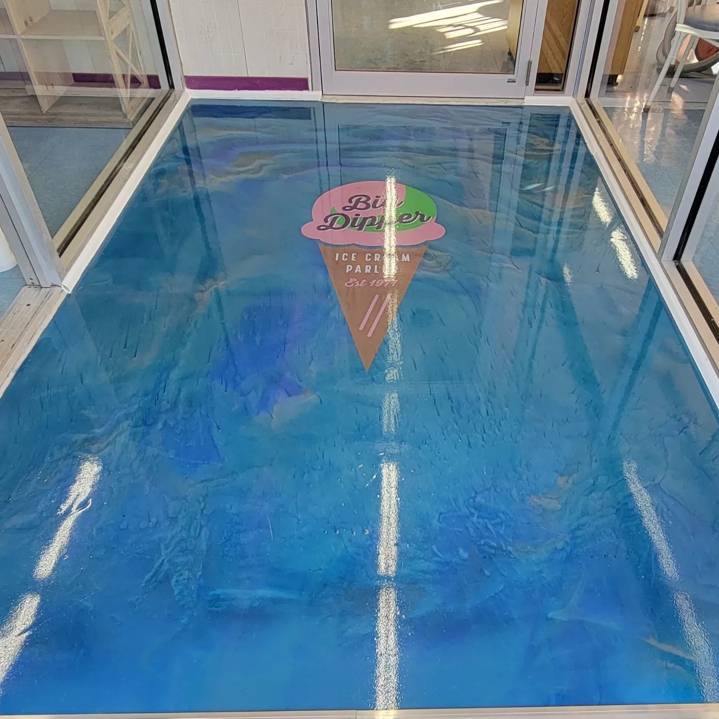 Metallic blue epoxy floor installed by J&K Precision Cleaning